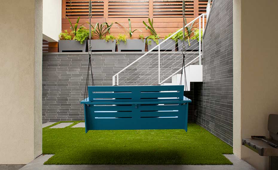 Smooth Grey Stone Feature Wall with Swing in Courtyard in San Francisco